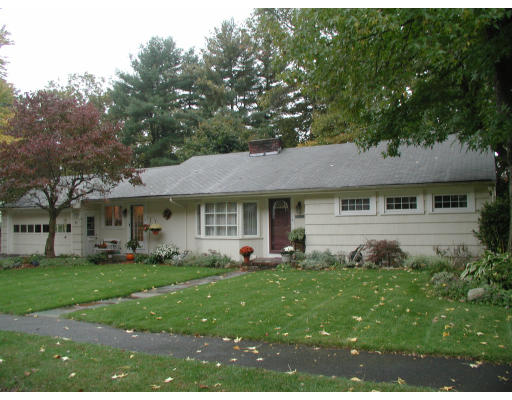 65 Donna Road Needham, MA 02494 - Photo 1 of 8 a front view of a house with a garden