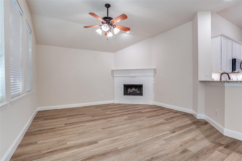 2129 Clubside Drive Corinth, TX 76210 - Photo 12 of 39 wooden floor in an empty room with a window