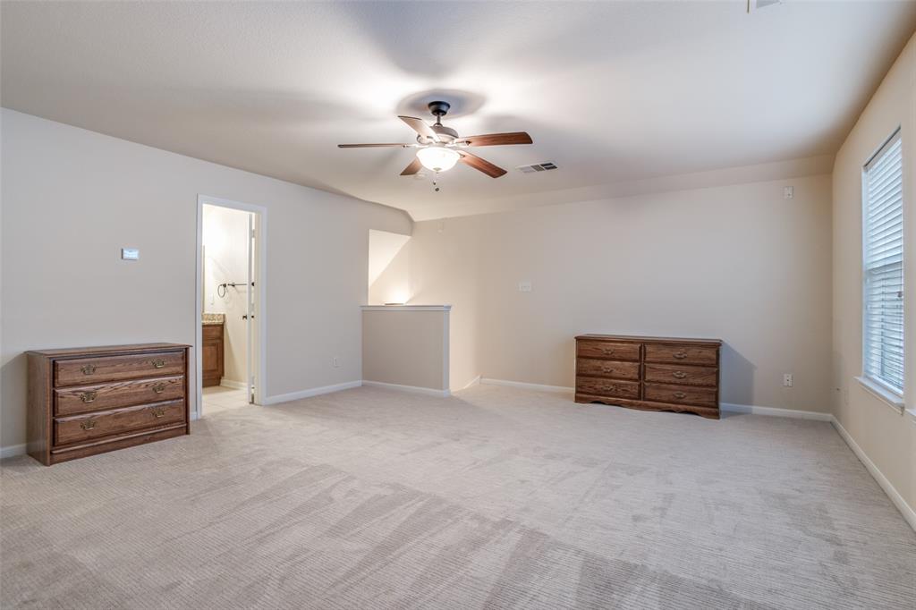 2129 Clubside Drive Corinth, TX 76210 - Photo 22 of 39 wooden floor in an empty room with a window