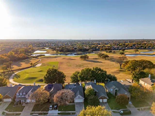 an aerial view of a house with a garden