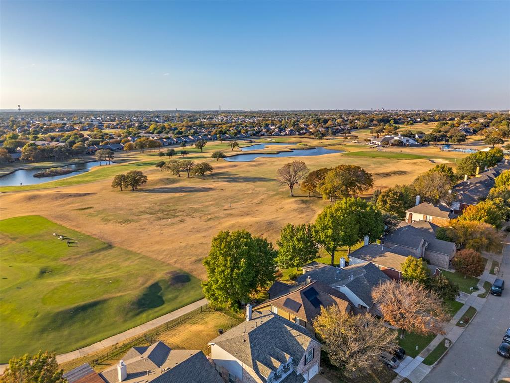2129 Clubside Drive Corinth, TX 76210 - Photo 33 of 39 an aerial view of a city with houses