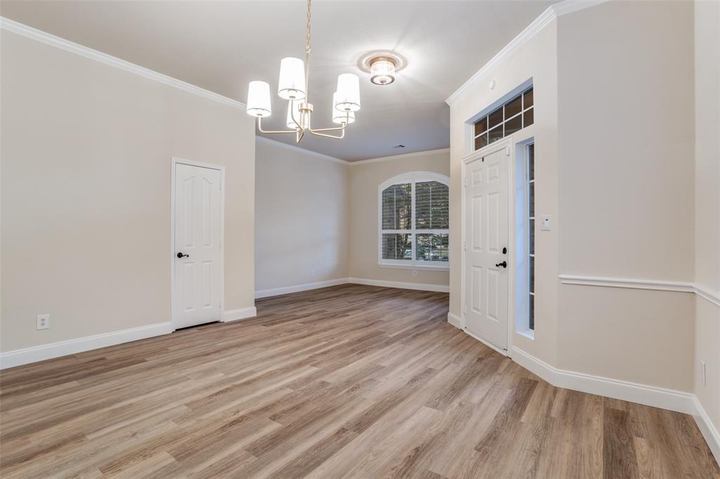 2129 Clubside Drive Corinth, TX 76210 - Photo 7 of 39 wooden floor in an empty room with a window