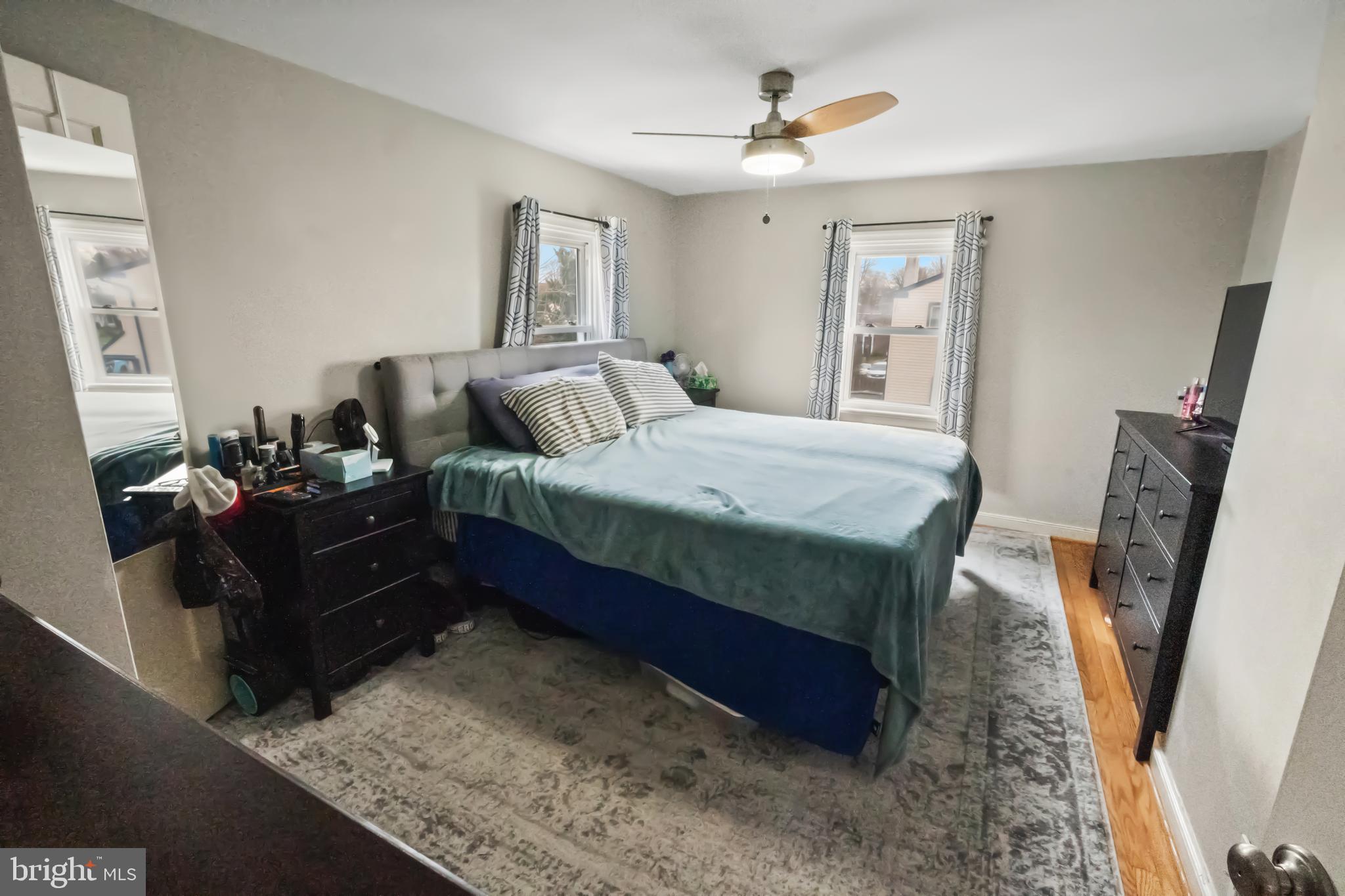 17 Upland Road Brookhaven, PA 19015 - Photo 15 of 25 a bed room with a bed window and a mirror