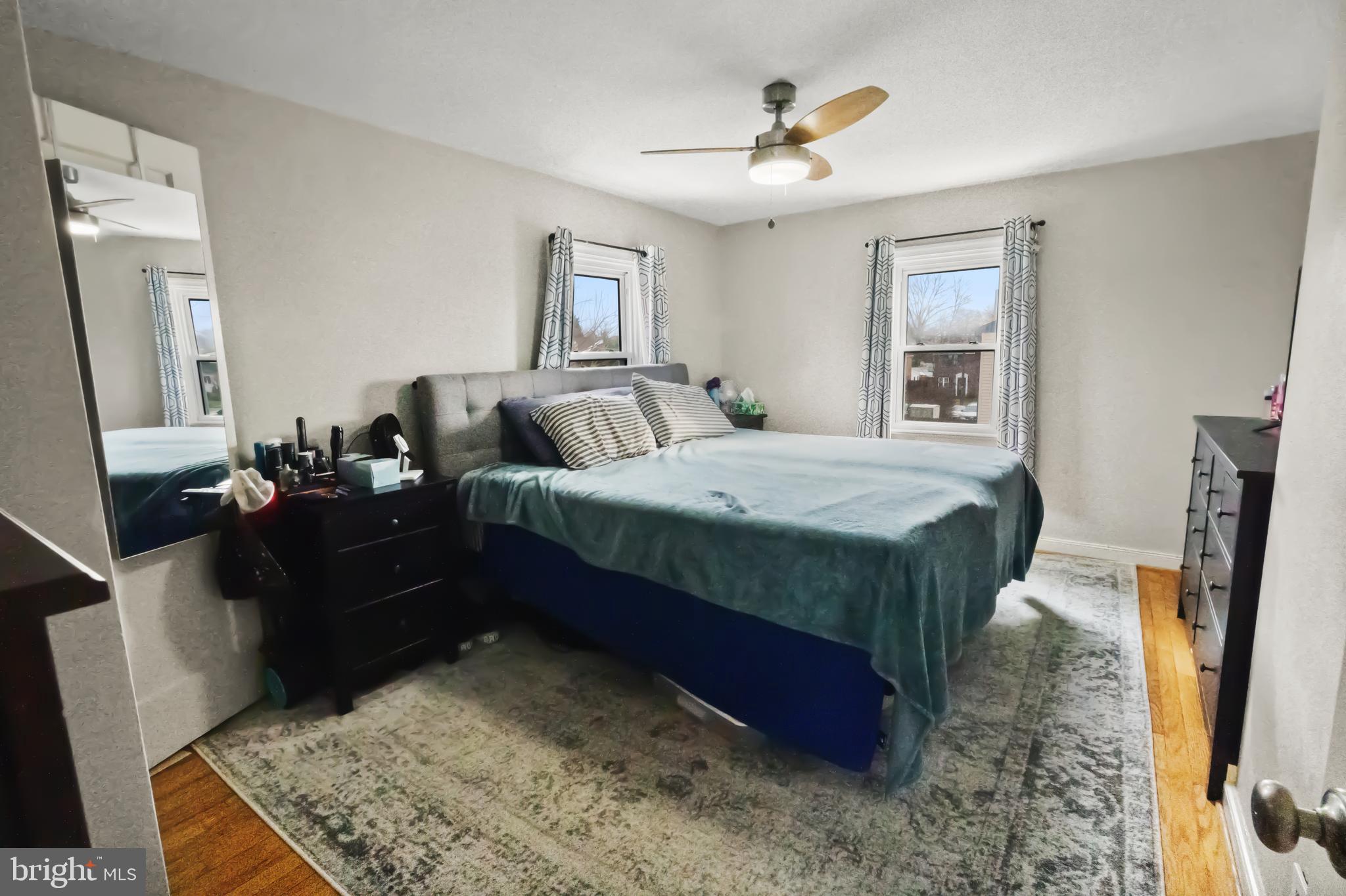 17 Upland Road Brookhaven, PA 19015 - Photo 17 of 25 a bed room with a bed window and a mirror