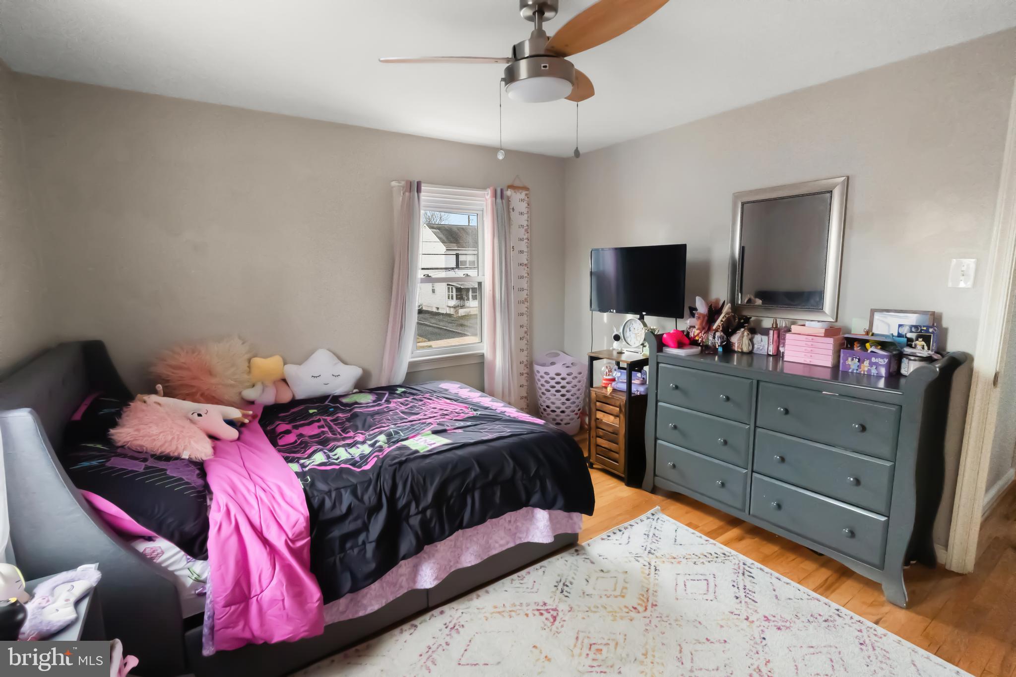 17 Upland Road Brookhaven, PA 19015 - Photo 20 of 25 a bedroom with a bed and wooden floor