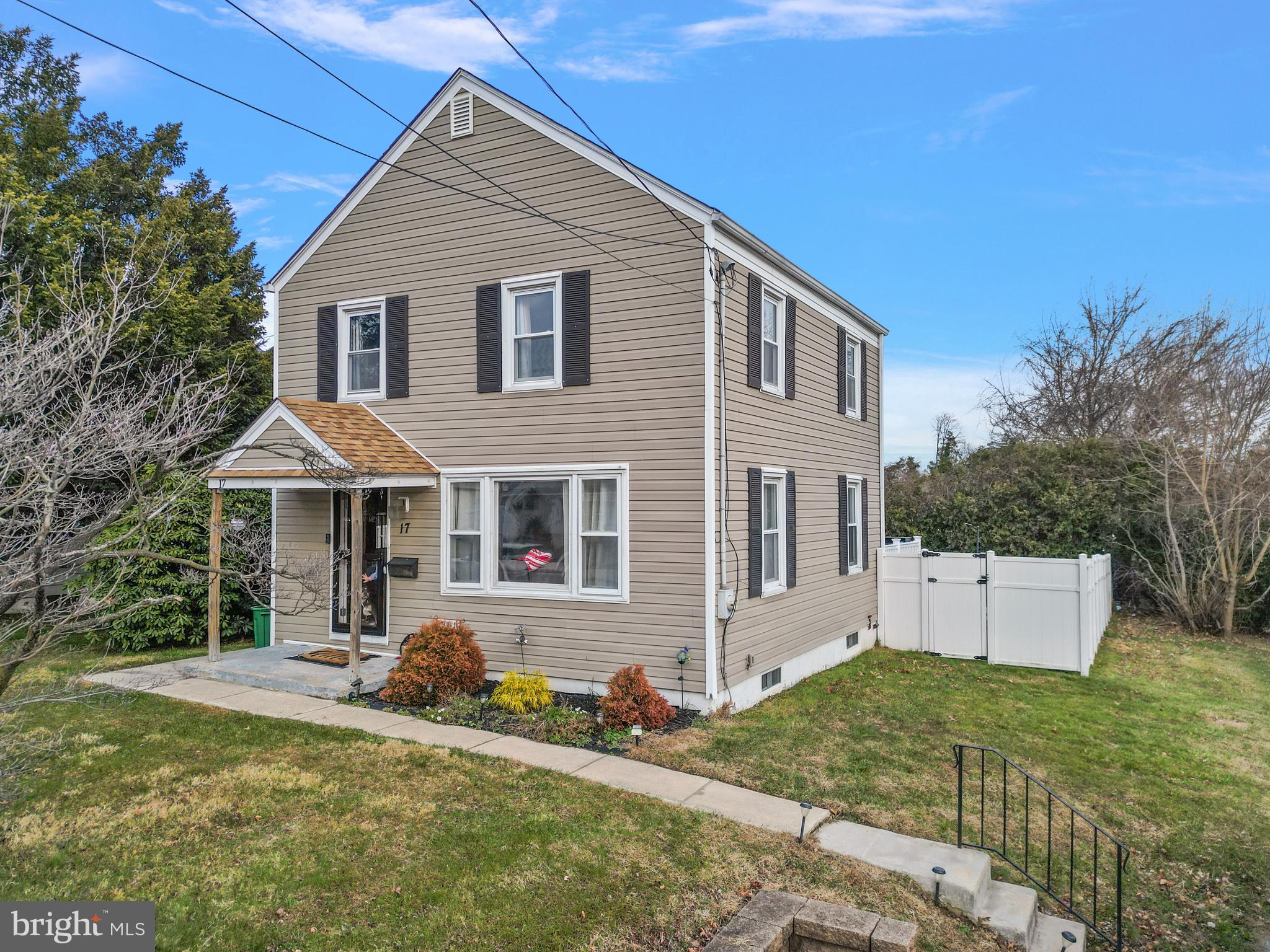 17 Upland Road Brookhaven, PA 19015 - Photo 3 of 25 a front view of a house with a yard