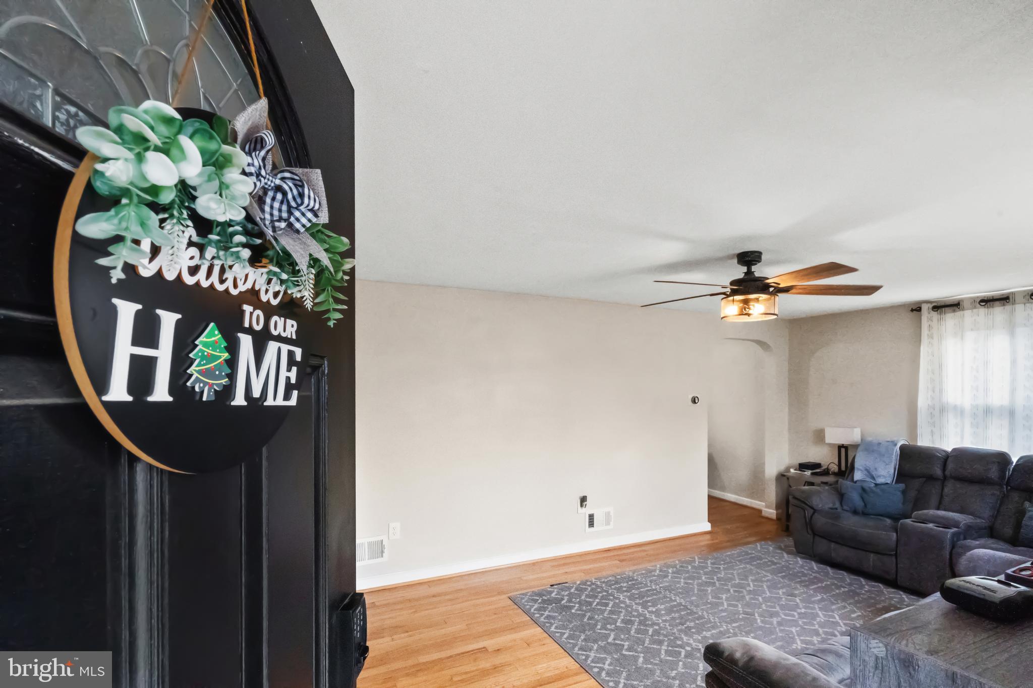 17 Upland Road Brookhaven, PA 19015 - Photo 4 of 25 a living room with furniture and a chandelier