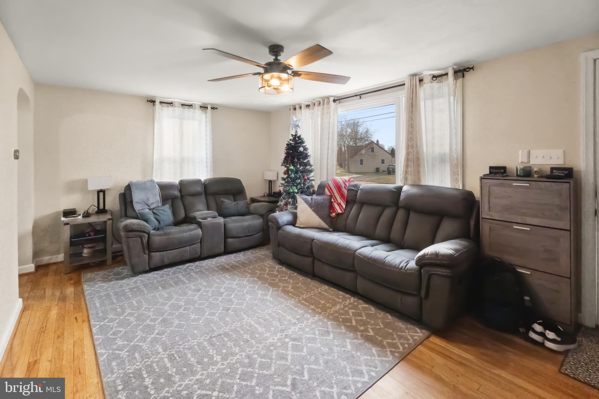 17 Upland Road Brookhaven, PA 19015 - Photo 5 of 25 a living room with furniture and a large window