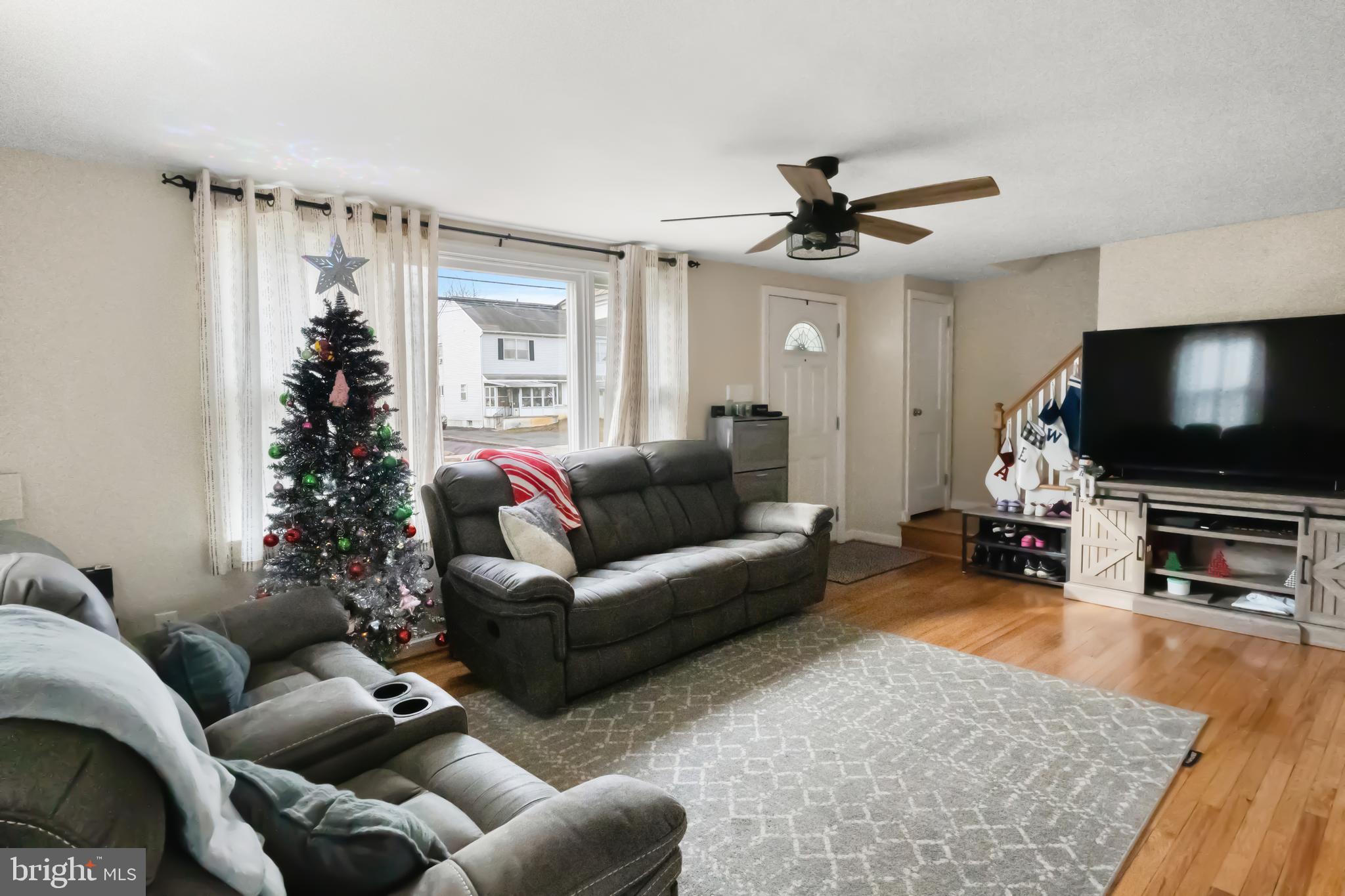 17 Upland Road Brookhaven, PA 19015 - Photo 6 of 25 a living room with furniture and a flat screen tv