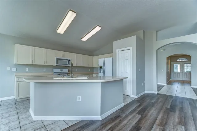 a bathroom with a sink double vanity granite tub shower and a mirror