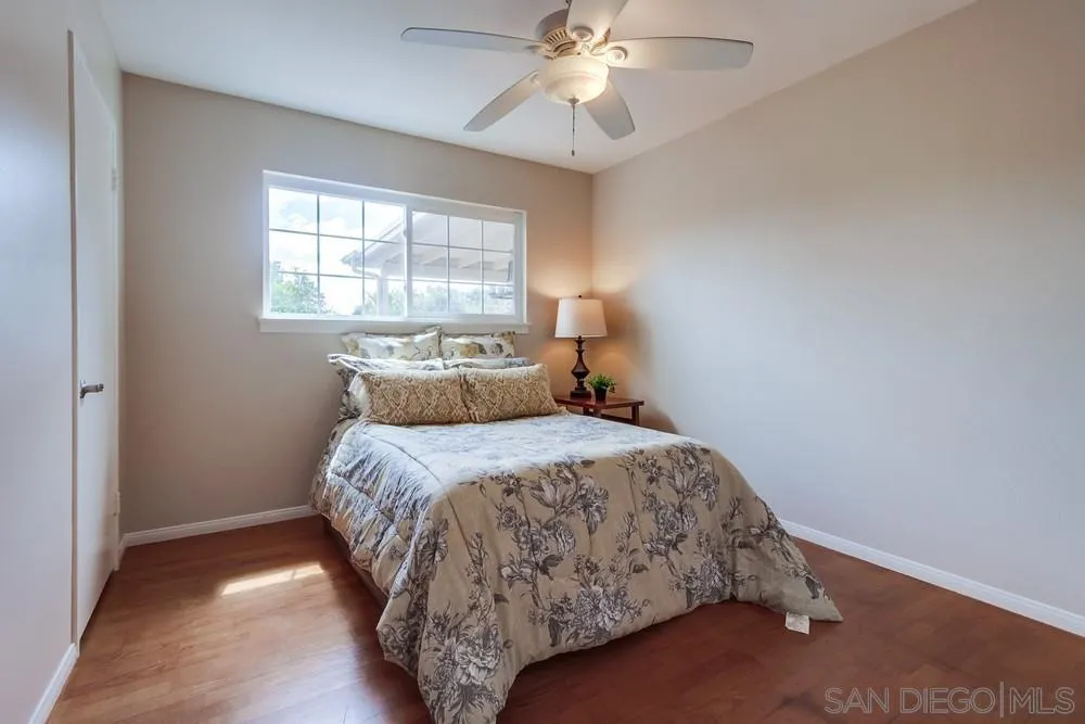 4441 Appleton Street San Diego, CA 92117 - Photo 15 of 29 a bedroom with a bed and window