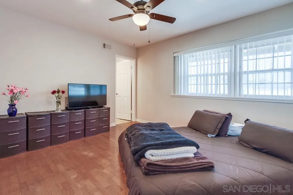 4441 Appleton Street San Diego, CA 92117 - Photo 18 of 29 a bedroom with a bed and furniture