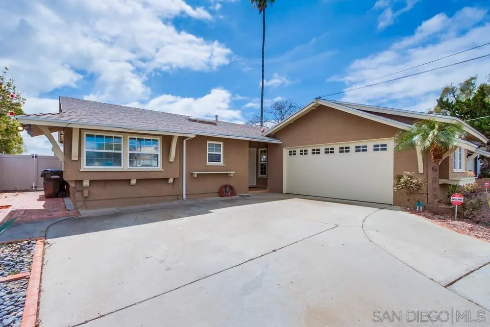 4441 Appleton Street San Diego, CA 92117 - Photo 2 of 29 a front view of a house with a yard