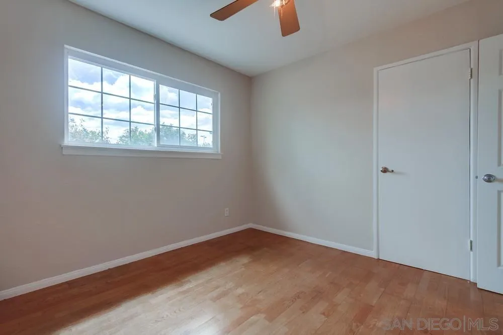 4441 Appleton Street San Diego, CA 92117 - Photo 22 of 29 an empty room with closet and window