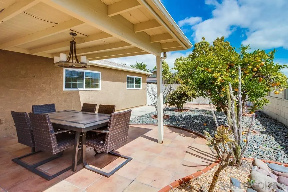 4441 Appleton Street San Diego, CA 92117 - Photo 26 of 29 a backyard of a house with table and chairs