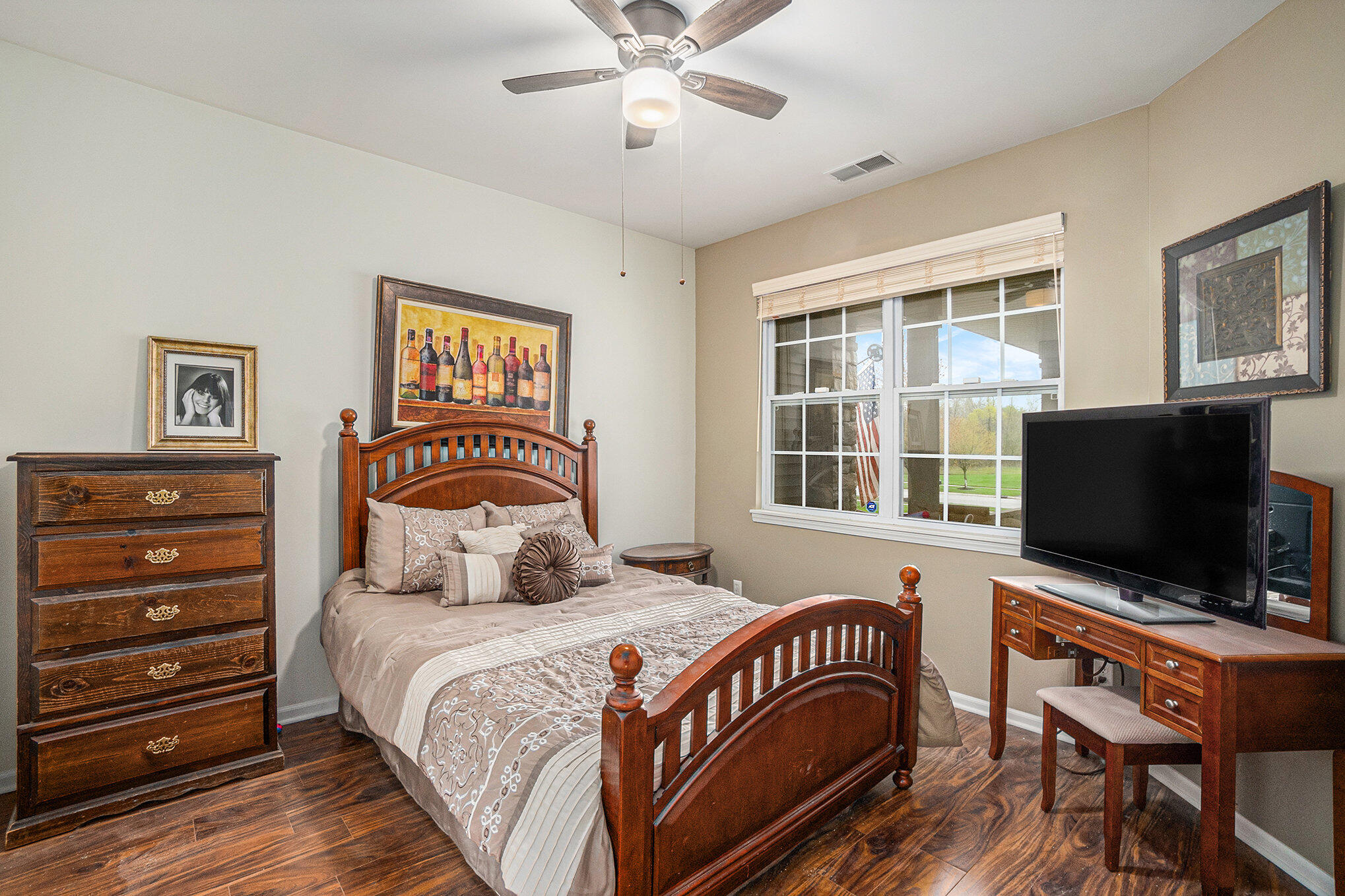 12190 80th Place Dyer, IN 46311 - Photo 14 of 16 a bedroom with a bed and a flat screen tv