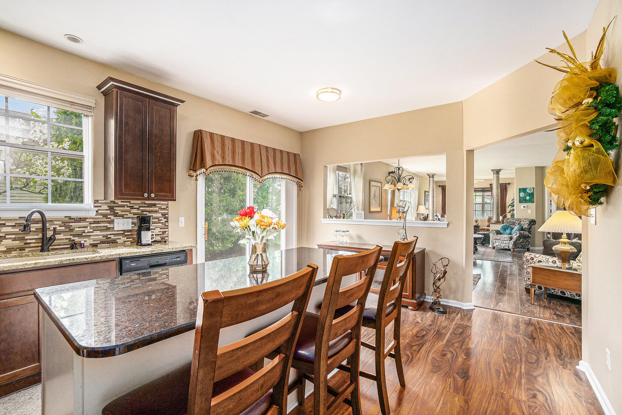 12190 80th Place Dyer, IN 46311 - Photo 4 of 16 a view of a dining room with furniture a chandelier and wooden floor