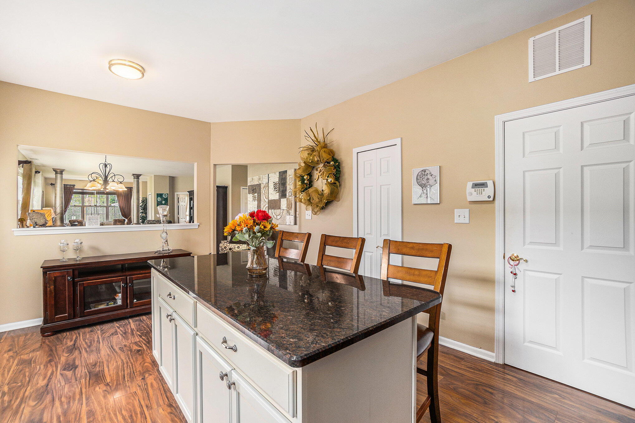 12190 80th Place Dyer, IN 46311 - Photo 6 of 16 a kitchen with granite countertop a dining table chairs and granite counter tops