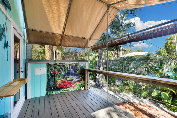 a view of a balcony with wooden floor