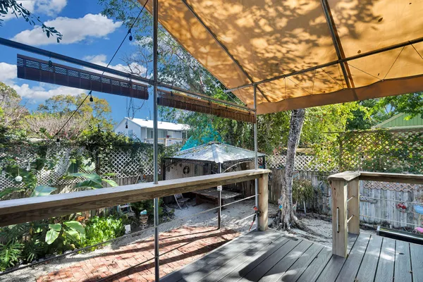 a view of balcony with wooden floor and outdoor seating