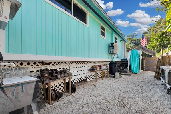a view of an outdoor sitting area with brick walls