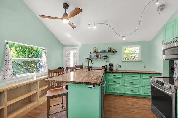a kitchen with sink and window