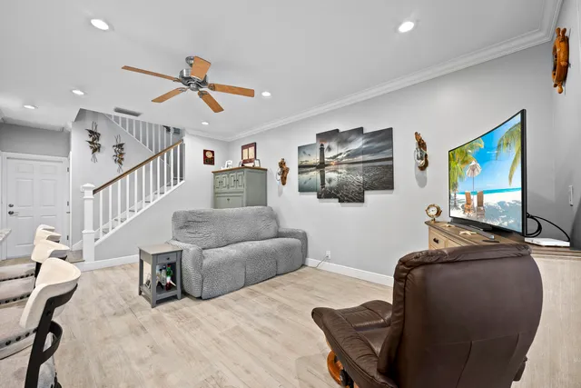 a large kitchen with a table and chairs