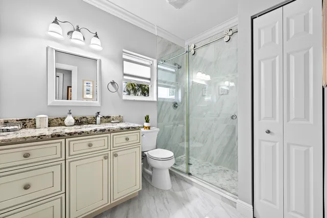 a kitchen with stainless steel appliances a stove a sink and a window