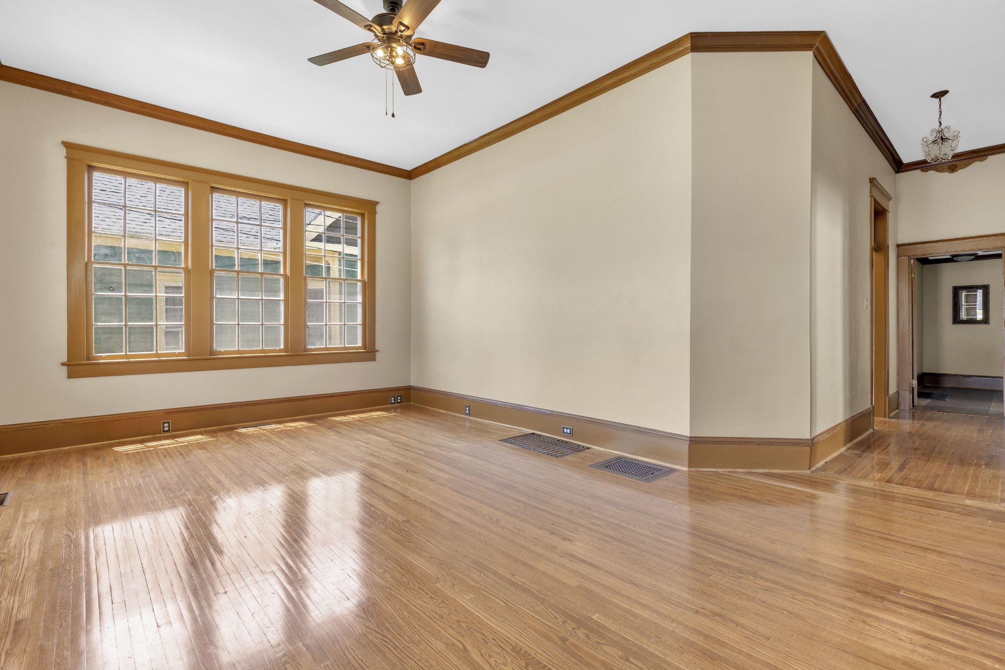 115 North Main Street Springfield, TN 37172 - Photo 13 of 24 a view of an empty room with a window and wooden floor