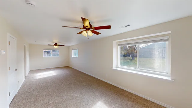 a view of an empty room with a window