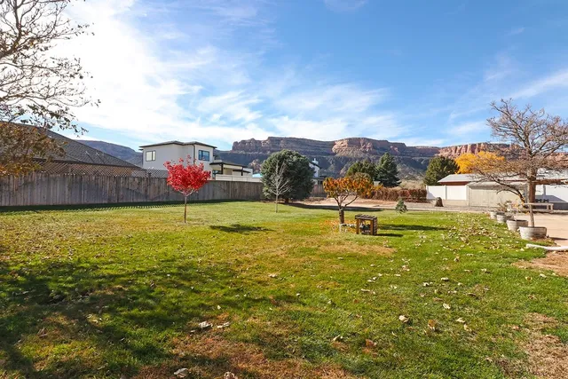 an aerial view of multiple houses with outdoor space
