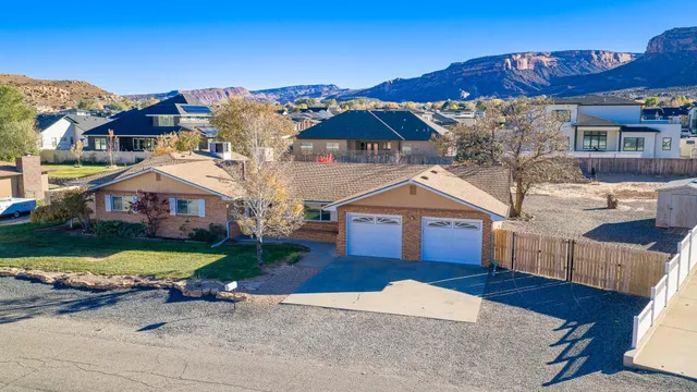 a front view of a house with a yard and balcony