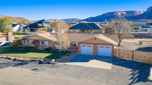 an aerial view of a house with yard swimming pool and outdoor seating