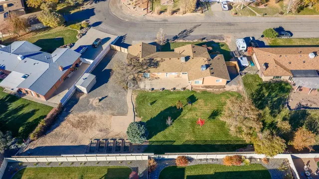 an aerial view of residential houses with outdoor space
