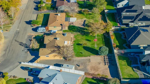 an aerial view of a house with a swimming pool