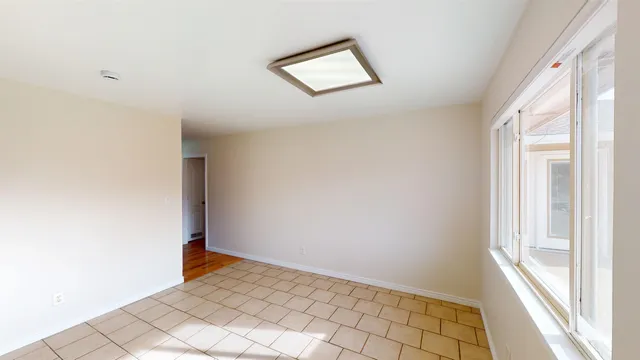 a view of an empty room and window