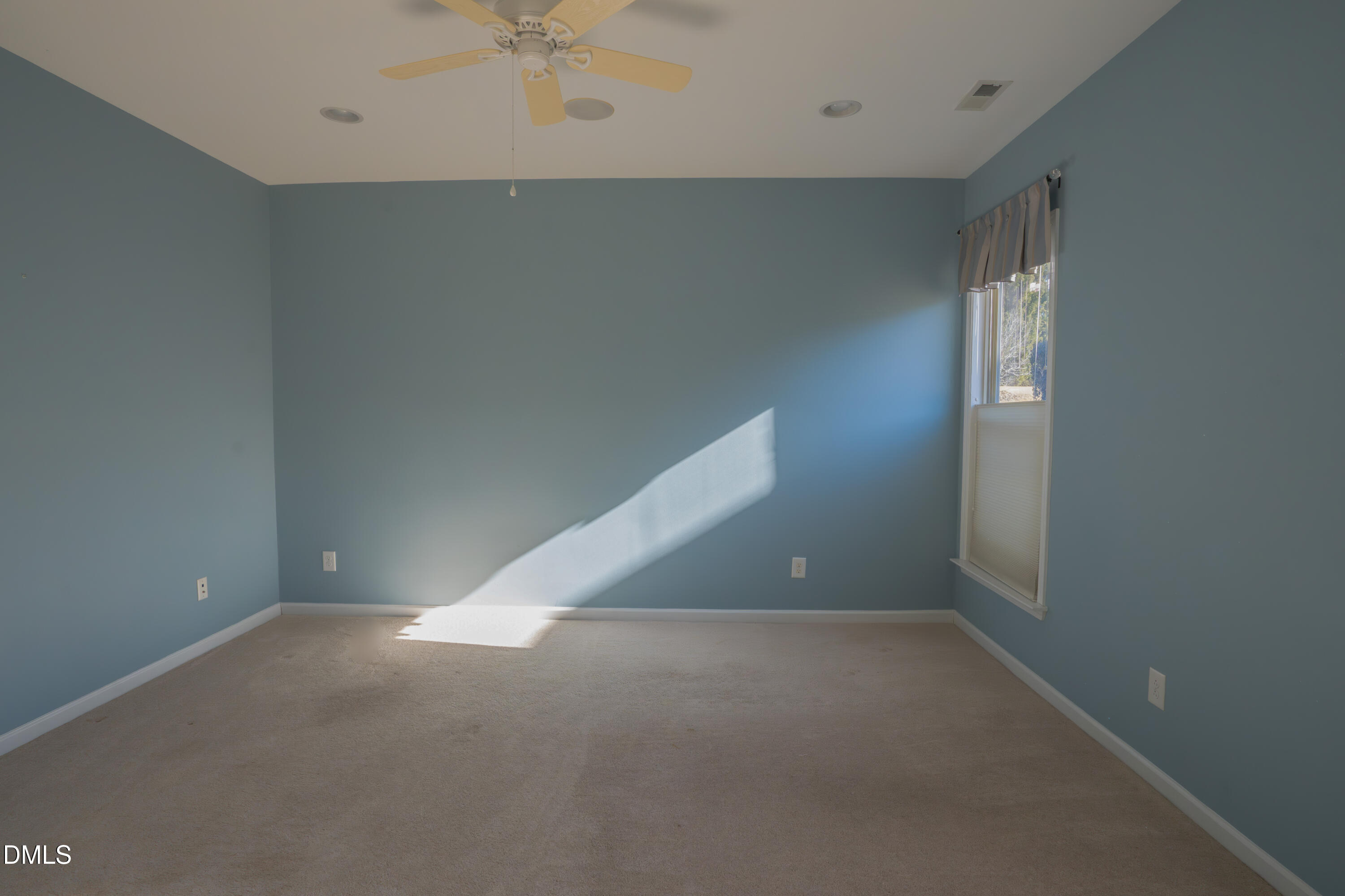 314 Rosedale Creek Drive Durham, NC 27703 - Photo 17 of 33 an empty room with a ceiling fan and entryway