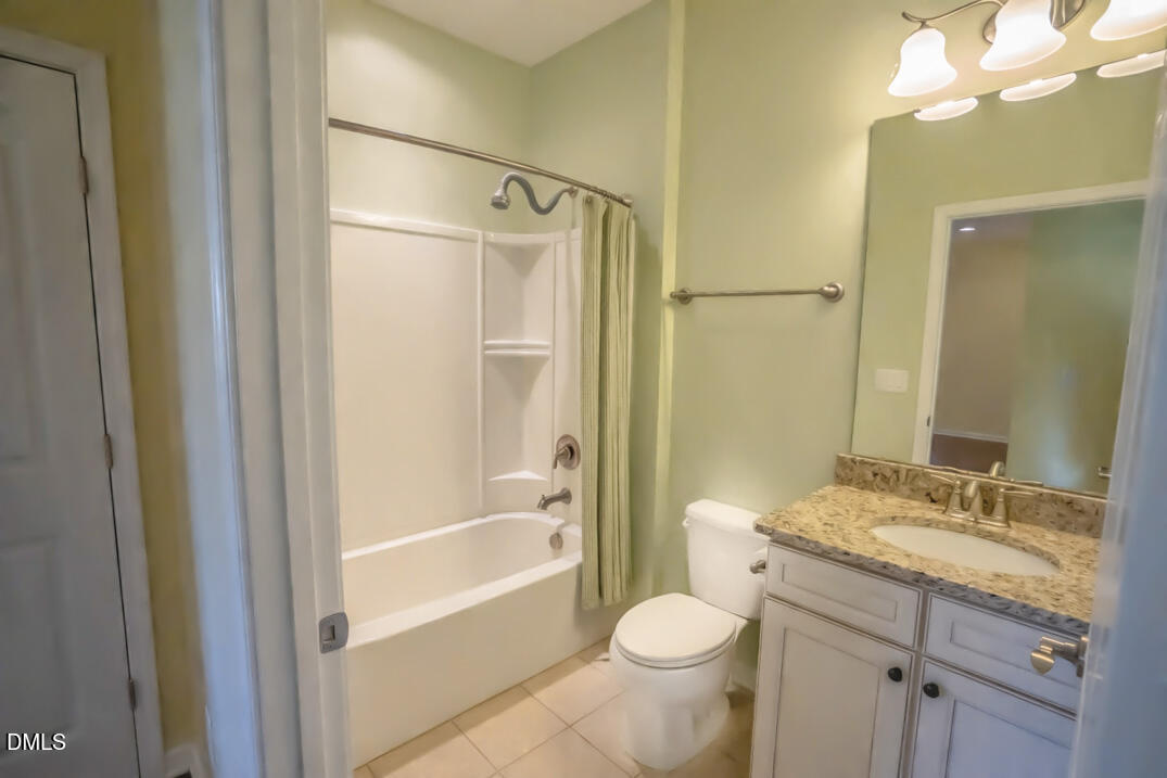 314 Rosedale Creek Drive Durham, NC 27703 - Photo 23 of 33 a bathroom with a granite countertop sink toilet and shower