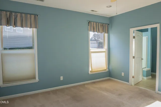 an empty room with windows