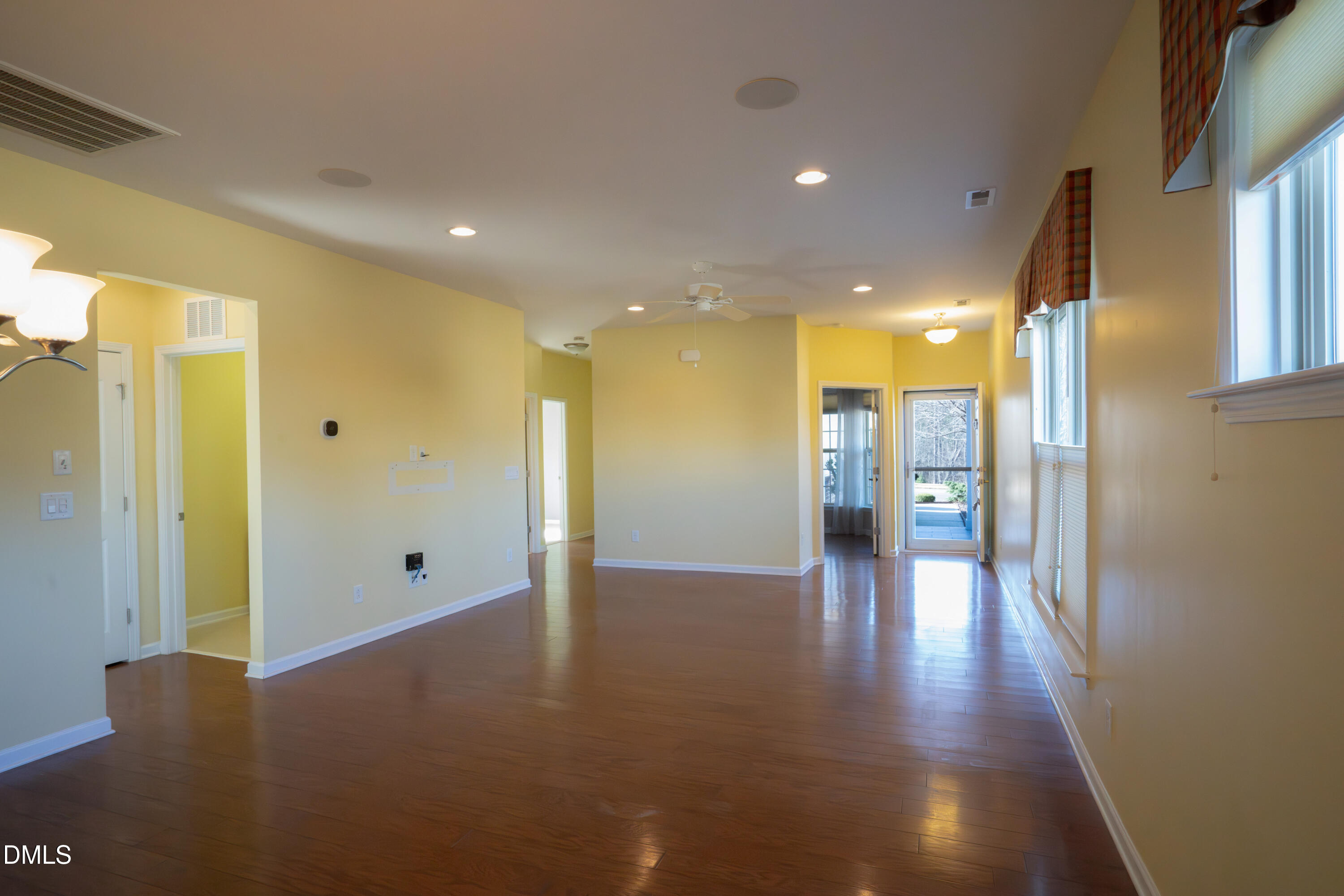 314 Rosedale Creek Drive Durham, NC 27703 - Photo 6 of 33 a view of a hallway with wooden floor