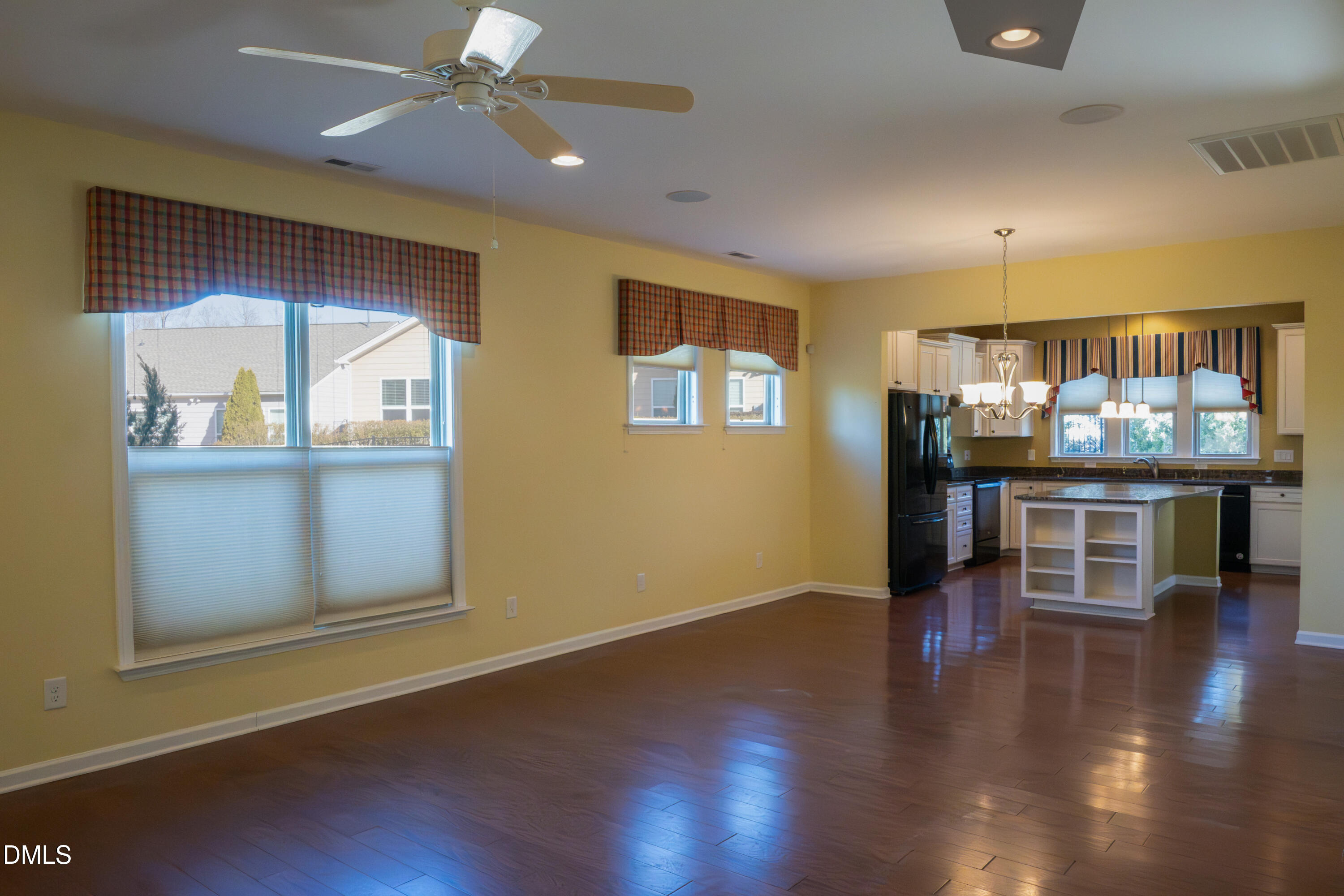 314 Rosedale Creek Drive Durham, NC 27703 - Photo 7 of 33 an empty room with wooden floor and windows