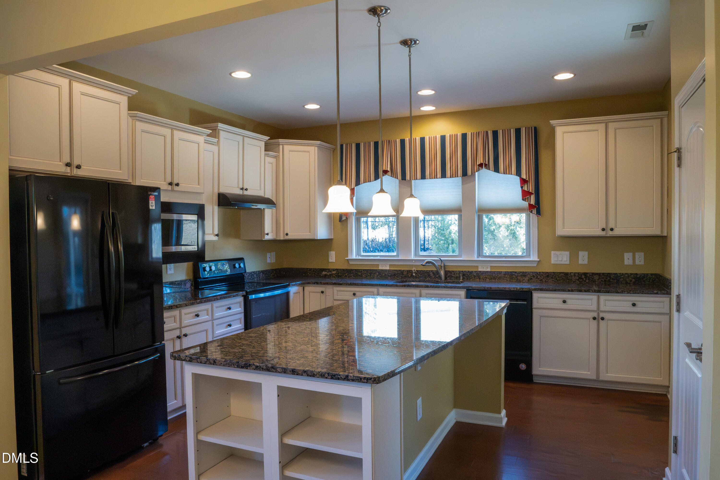 314 Rosedale Creek Drive Durham, NC 27703 - Photo 8 of 33 a kitchen with granite countertop a sink a counter space appliances and cabinets