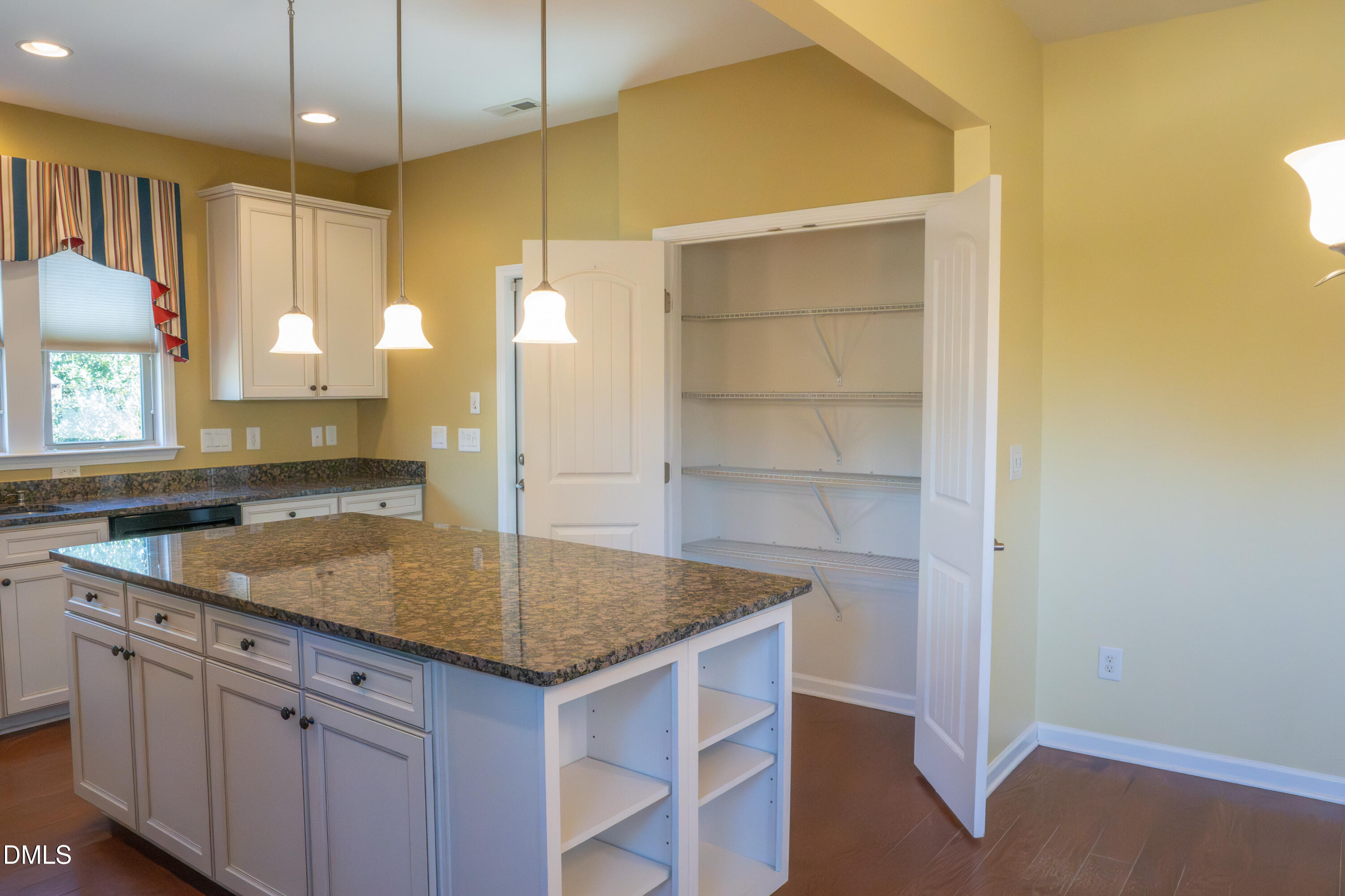 314 Rosedale Creek Drive Durham, NC 27703 - Photo 10 of 33 a kitchen with a sink a counter space and a window