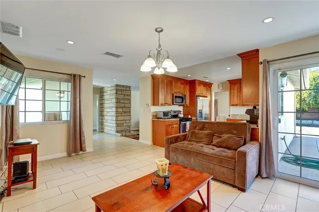 a living room with fireplace furniture and a window