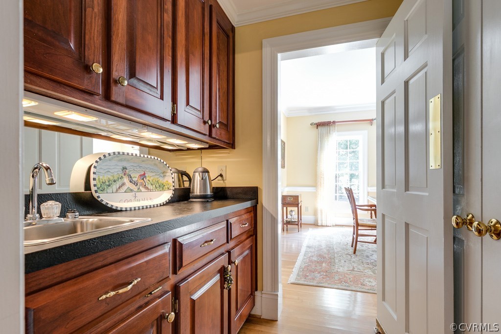 304 Hill Point Road Richmond, VA 23238 - Photo 11 of 50 Butler's Pantry with built-in cabinetry and a doub