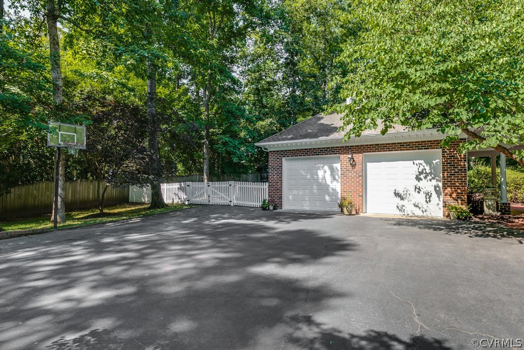 304 Hill Point Road Richmond, VA 23238 - Photo 49 of 50 Photo highlighting the garage and separate fenced