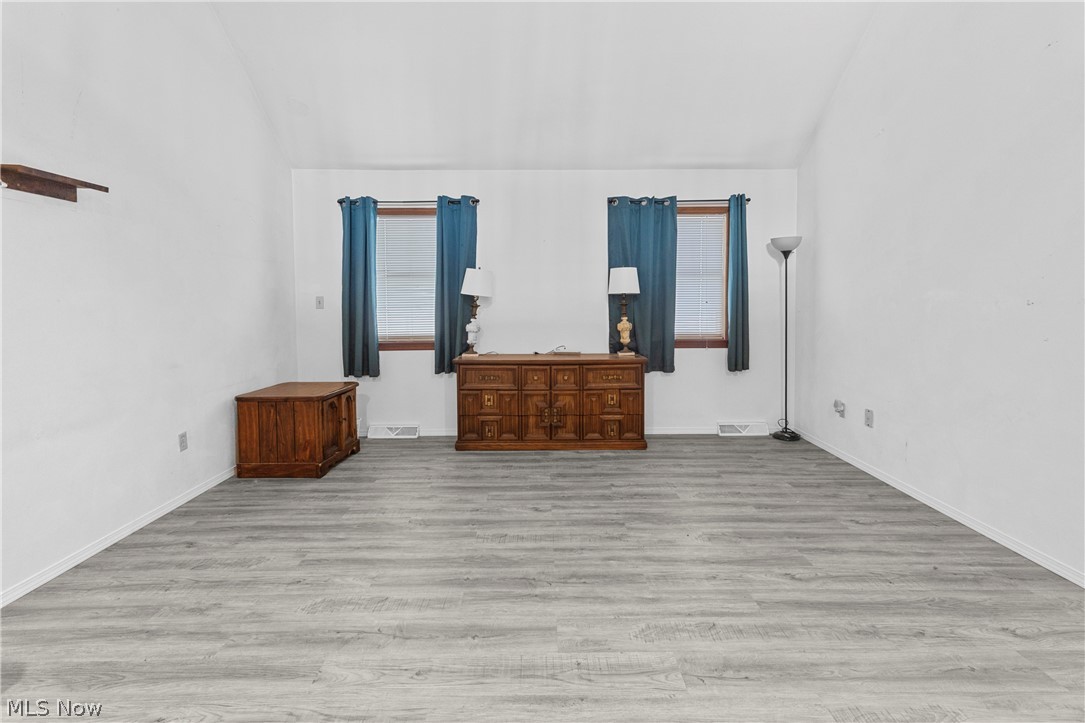 140 Iris Lane Colliers, WV 26035 - Photo 16 of 47 Unfurnished bedroom featuring vaulted ceiling and light hardwood / wood-style flooring