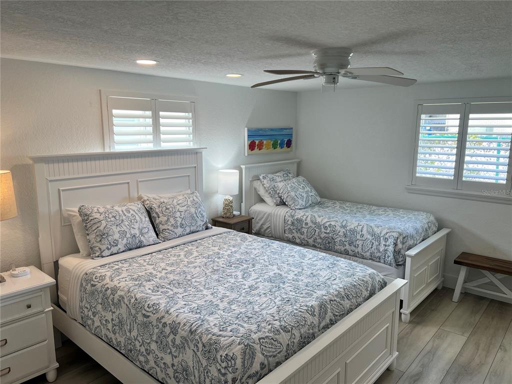6154 Midnight Pass Road, Unit A15 Sarasota, FL 34242 - Photo 17 of 17 a bedroom with a large bed and a window