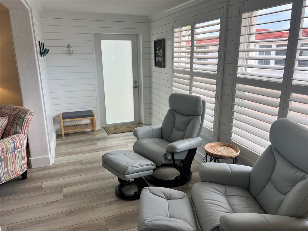 6154 Midnight Pass Road, Unit A15 Sarasota, FL 34242 - Photo 6 of 17 a living room with furniture and a large window