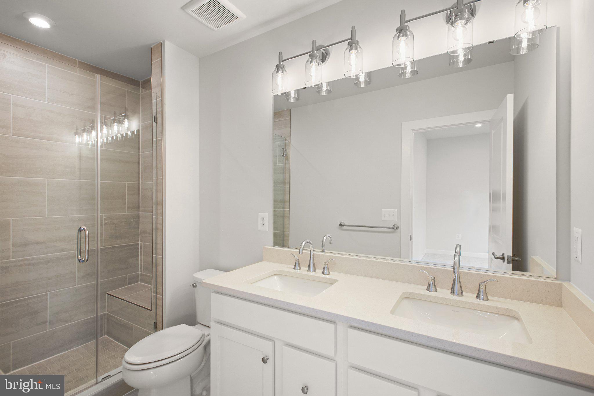 3811 Shale Ridge Road Woodbridge, VA 22193 - Photo 16 of 26 Sleek modern bathroom with elegant fixtures.